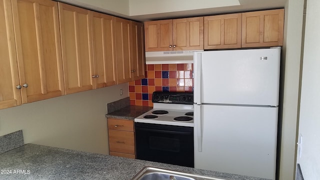 kitchen with tasteful backsplash, electric range oven, and white refrigerator