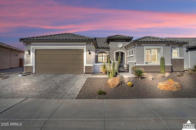 mediterranean / spanish-style home featuring a garage