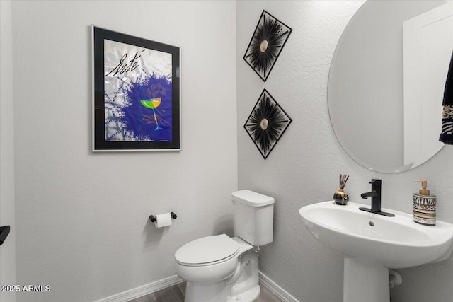 bathroom with toilet and sink