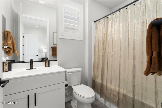 full bathroom featuring toilet, vanity, and shower / bathtub combination with curtain