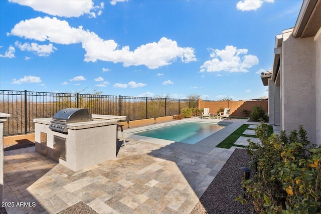 view of swimming pool featuring a patio area, grilling area, and area for grilling