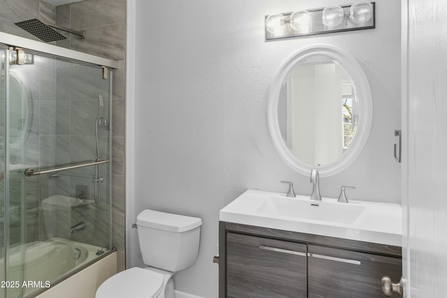 6920 W Via Montoya Dr, Glendale, AZ 85310 - bathroom featuring bath / shower combo with glass door, vanity, and toilet