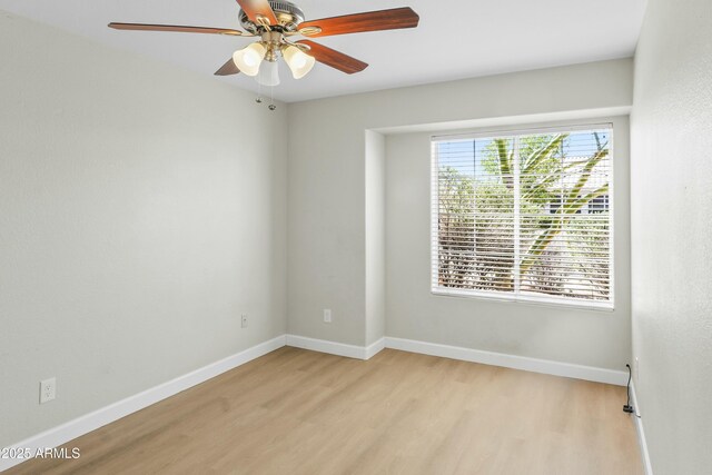 6920 W Via Montoya Dr, Glendale, AZ 85310 - unfurnished room featuring light wood-type flooring, baseboards, and a ceiling fan