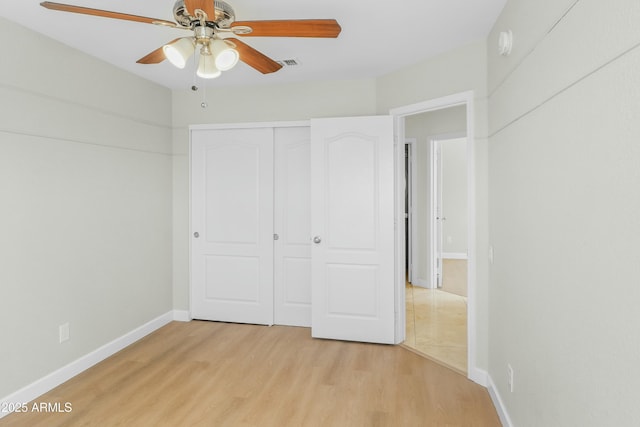 6920 W Via Montoya Dr, Glendale, AZ 85310 - unfurnished bedroom featuring a closet, baseboards, visible vents, ceiling fan, and light wood finished floors