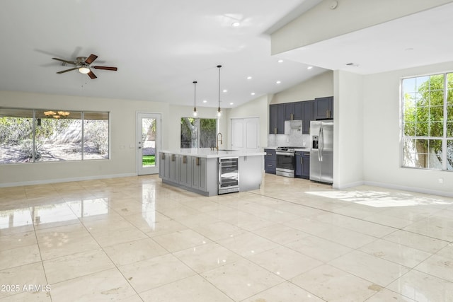 6920 W Via Montoya Dr, Glendale, AZ 85310 - unfurnished living room with wine cooler, a sink, vaulted ceiling, and plenty of natural light