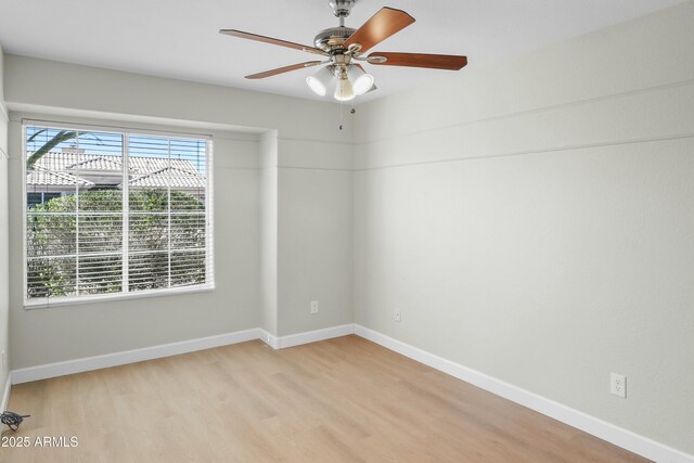 6920 W Via Montoya Dr, Glendale, AZ 85310 - unfurnished room with light wood-style flooring, baseboards, and a ceiling fan
