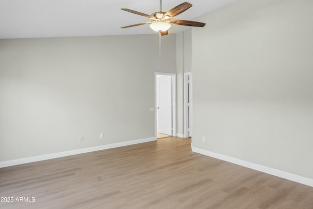 6920 W Via Montoya Dr, Glendale, AZ 85310 - spare room with ceiling fan, light wood-style floors, high vaulted ceiling, and baseboards
