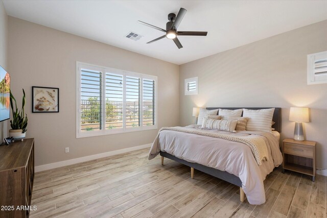 5724 E Scarlet St, Mesa, AZ 85215 - bedroom featuring light wood finished floors and a ceiling fan
