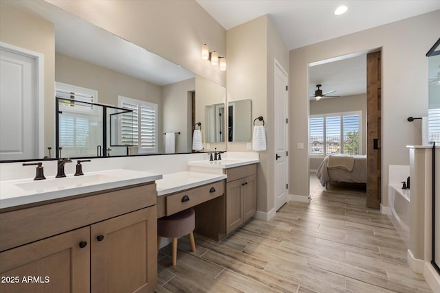 5724 E Scarlet St, Mesa, AZ 85215 - bathroom with ensuite bath, ceiling fan, vanity, wood finished floors, and a shower stall