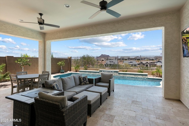 5724 E Scarlet St, Mesa, AZ 85215 - fenced backyard with a jacuzzi, ceiling fan, a patio area, and outdoor dining area