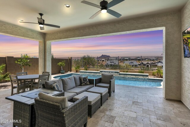 5724 E Scarlet St, Mesa, AZ 85215 - patio terrace at dusk with a hot tub, a ceiling fan, and a patio