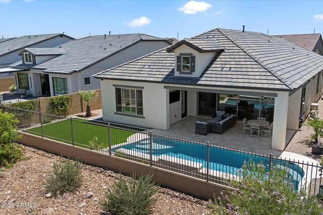 5724 E Scarlet St, Mesa, AZ 85215 - back of property featuring stucco siding, a fenced backyard, an outdoor living space, and a patio area