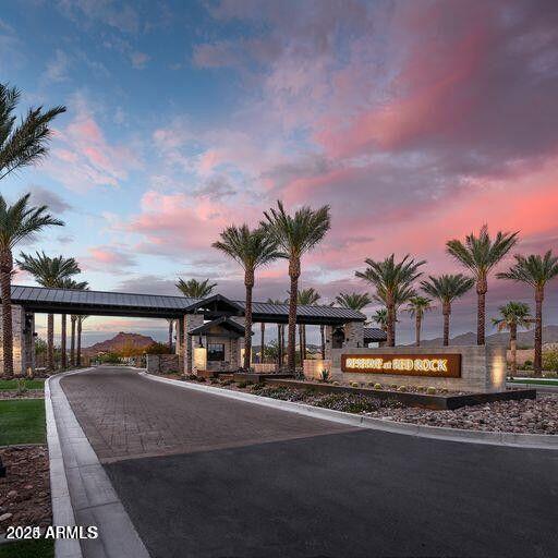 5724 E Scarlet St, Mesa, AZ 85215 - view of asphalt street with curbs and a gated entry