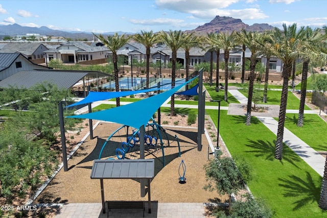 5724 E Scarlet St, Mesa, AZ 85215 - surrounding community with a residential view, a mountain view, and a lawn