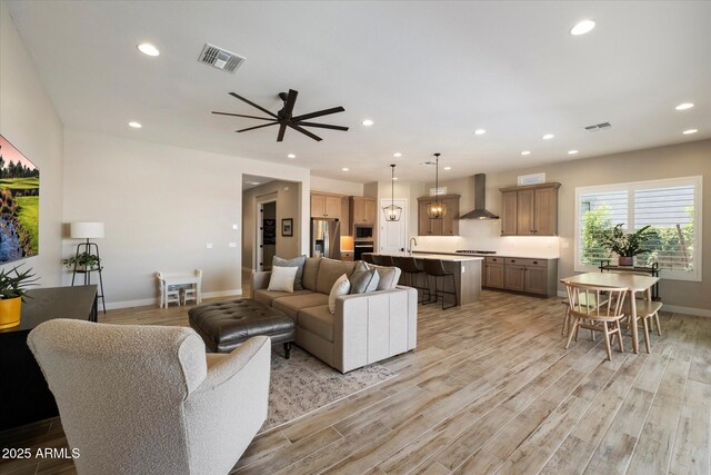 5724 E Scarlet St, Mesa, AZ 85215 - living area featuring light wood-type flooring, recessed lighting, and ceiling fan