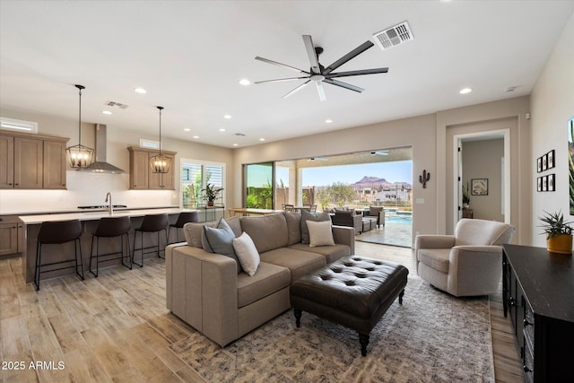 5724 E Scarlet St, Mesa, AZ 85215 - living area with light wood-type flooring, recessed lighting, and ceiling fan