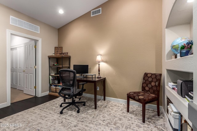 office space featuring visible vents and baseboards