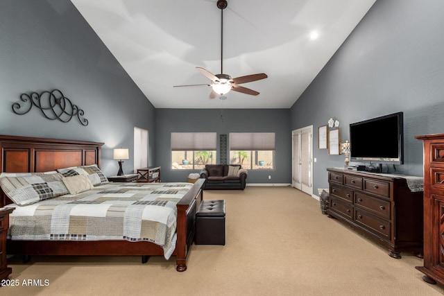 bedroom with baseboards, high vaulted ceiling, a ceiling fan, and light colored carpet