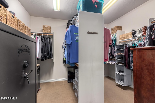 spacious closet with carpet flooring