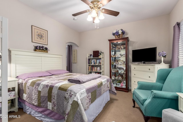 bedroom featuring ceiling fan and carpet