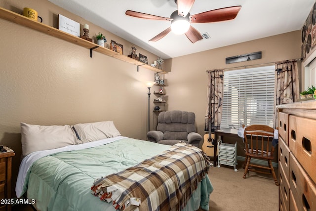 bedroom with light carpet, ceiling fan, and visible vents