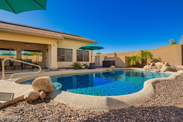 view of pool featuring a patio area, fence, and a fenced in pool