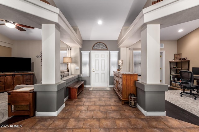 foyer entrance with a ceiling fan, recessed lighting, stone finish floor, and baseboards