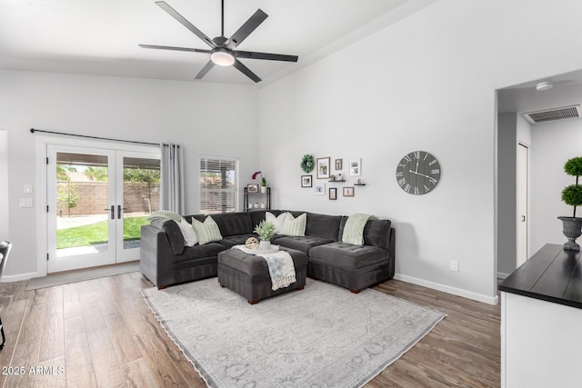 510 S Saddle St, Gilbert, AZ 85233 - living room featuring wood finished floors, ceiling fan, french doors, baseboards, and visible vents