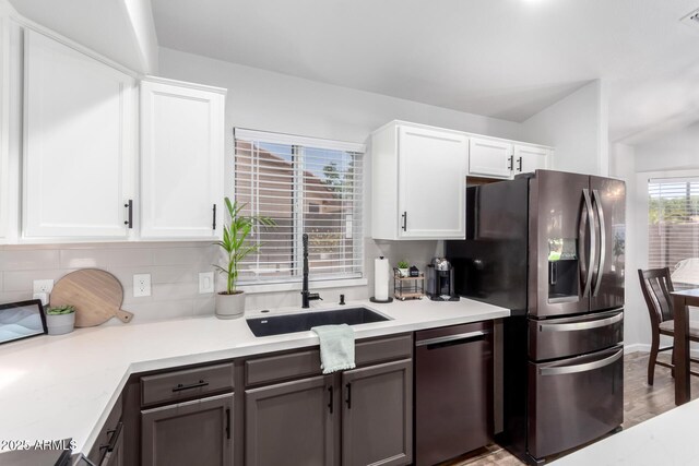 510 S Saddle St, Gilbert, AZ 85233 - kitchen featuring tasteful backsplash, a sink, light countertops, white cabinets, and appliances with stainless steel finishes