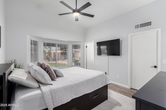 510 S Saddle St, Gilbert, AZ 85233 - bedroom featuring wood finished floors, ceiling fan, baseboards, lofted ceiling, and visible vents