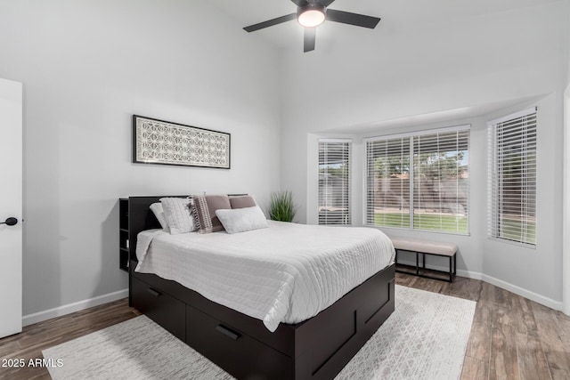 510 S Saddle St, Gilbert, AZ 85233 - bedroom with wood finished floors, a high ceiling, baseboards, and ceiling fan
