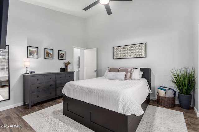 510 S Saddle St, Gilbert, AZ 85233 - bedroom with ceiling fan, a high ceiling, baseboards, and dark wood-style flooring