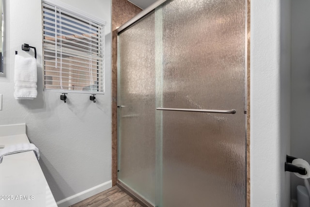 510 S Saddle St, Gilbert, AZ 85233 - bathroom featuring baseboards, wood finished floors, vanity, and a stall shower