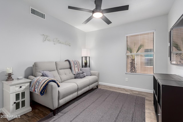 510 S Saddle St, Gilbert, AZ 85233 - living area with wood finished floors, visible vents, baseboards, and ceiling fan