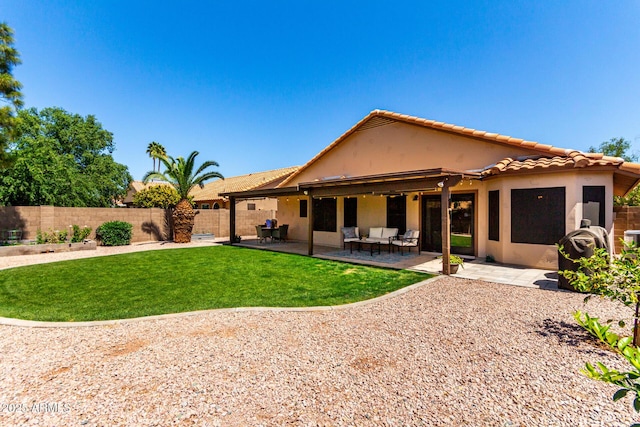 510 S Saddle St, Gilbert, AZ 85233 - back of house with a tiled roof, a fenced backyard, a yard, a patio, and stucco siding