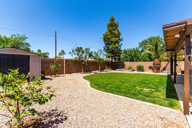 510 S Saddle St, Gilbert, AZ 85233 - view of yard featuring an outbuilding, a shed, and a fenced backyard