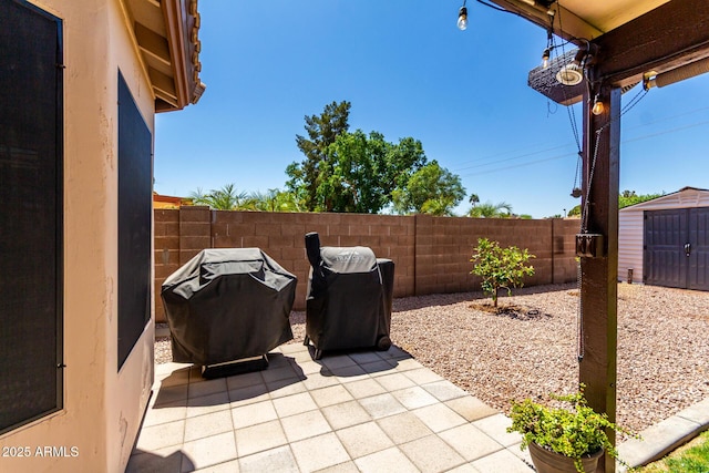 510 S Saddle St, Gilbert, AZ 85233 - view of patio / terrace with an outbuilding, a shed, area for grilling, and fence