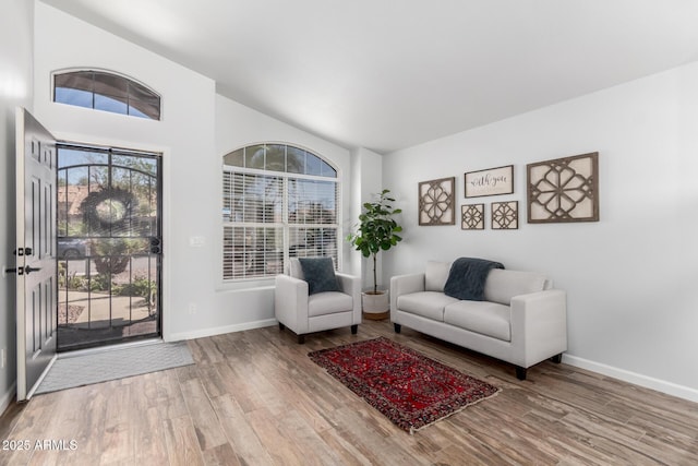 510 S Saddle St, Gilbert, AZ 85233 - sitting room with baseboards, lofted ceiling, and wood finished floors