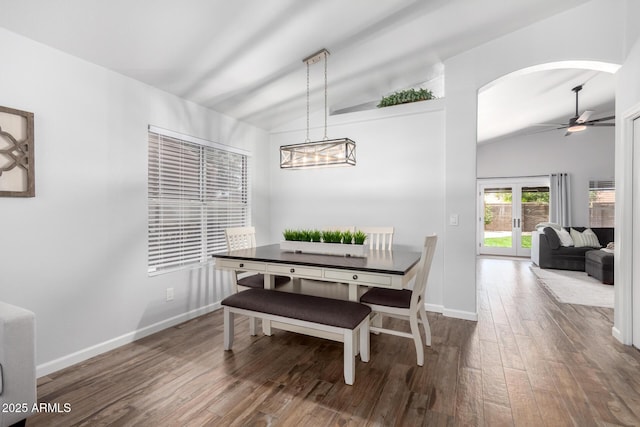 510 S Saddle St, Gilbert, AZ 85233 - dining area with vaulted ceiling, wood finished floors, ceiling fan with notable chandelier, arched walkways, and baseboards