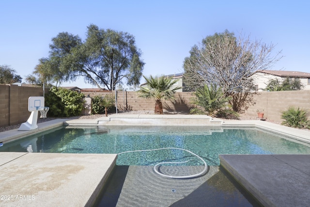 view of swimming pool featuring a fenced in pool and a fenced backyard