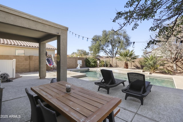 view of patio featuring a fenced backyard and a fenced in pool