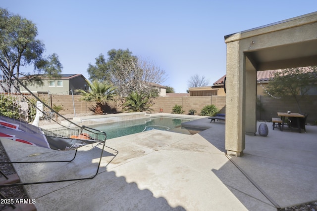 view of pool featuring a fenced backyard and a patio