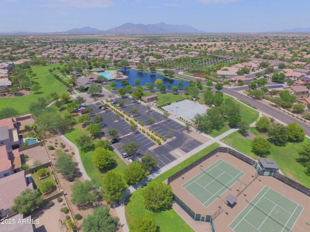 drone / aerial view featuring a water and mountain view