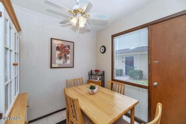 dining room featuring light tile patterned floors and ceiling fan