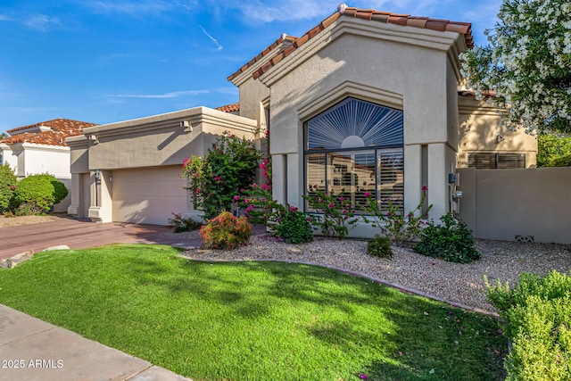 7439 E Beryl Ave, Scottsdale, AZ 85258 - view of front facade with stucco siding, an attached garage, a front yard, and a tiled roof