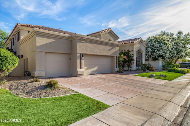 7439 E Beryl Ave, Scottsdale, AZ 85258 - mediterranean / spanish home with a garage, stucco siding, a tiled roof, concrete driveway, and a front lawn