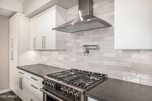 7439 E Beryl Ave, Scottsdale, AZ 85258 - kitchen with stainless steel gas range oven, wall chimney range hood, white cabinetry, baseboards, and dark wood-type flooring