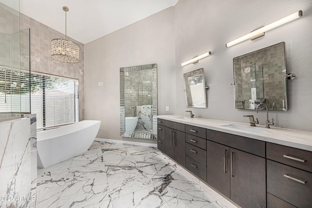 7439 E Beryl Ave, Scottsdale, AZ 85258 - bathroom with marble tiled flooring, double vanity, a freestanding tub, and tiled shower