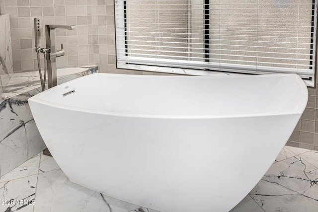 7439 E Beryl Ave, Scottsdale, AZ 85258 - bathroom with marble tiled flooring, a freestanding bath, and tile walls