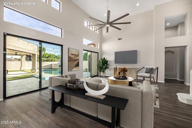 7439 E Beryl Ave, Scottsdale, AZ 85258 - living area featuring a high ceiling, wood finished floors, a ceiling fan, baseboards, and recessed lighting
